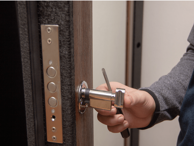 Expert Locksmith Working on Door in Yuba City, CA